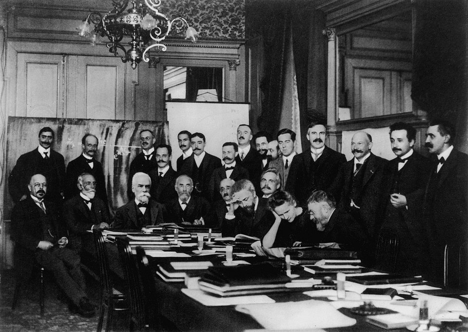 The first Solvay Conference, Brussels, November 1911. Eighteen physicists including Einstein and Marie Curie debated the theory of radiation and quanta as classical physics gave way to quantum theory.